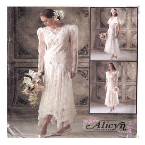 May include: A vintage wedding dress pattern featuring three different bridal gown designs. The main dress is a long-sleeved, lace gown with a high neckline and a flowing skirt. The other two designs are also white, with varying sleeve lengths and skirt styles. The pattern is labeled "Alicyn Exclusives."
