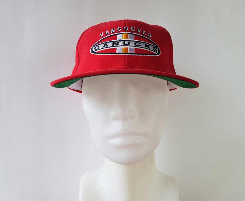 canucks skate logo hat