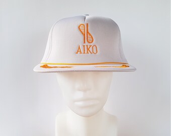 Vintage 80s AIKO Sporting Goods White Foam Trucker Snapback Hat Defunct Sports Logo Licensed Promo Rope Cap with Captain Laurel Style Visor