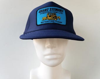 Vintage 80s GRANT STEWART Construction Watson Lake Yukon Trucker Hat - Full Foam Snapback Patch Promo Cap Bulldozer Tractor Young An Ballcap