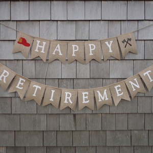 May include: A burlap banner with the words "Happy Retirement" in white lettering. The banner is decorated with red firefighter hats and crossed axes.