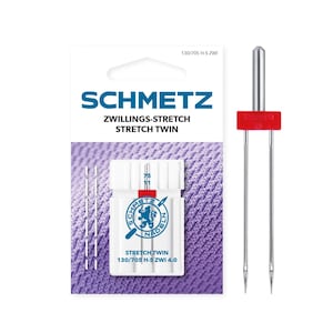 May include: A pack of SCHMETZ Stretch Twin sewing machine needles. The package is white with blue and red text. The needles are silver with a red plastic piece. The text on the package reads "SCHMETZ ZWILLINGS-STRETCH STRETCH TWIN".