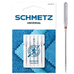May include: A pack of four silver sewing needles in a clear plastic case with the brand name "SCHMETZ UNIVERSAL" and the size "130/705 H" printed on the front. The needles are 80/12 size.