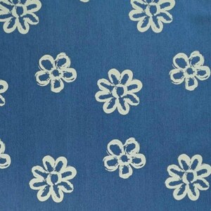 May include: A blue fabric with a white daisy pattern. The daisies are hand-drawn and have a slightly distressed look.