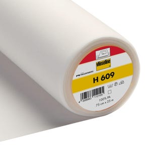 May include: A roll of white Vlieseline H 609 fusible interfacing, a product for sewing and crafts. The label is yellow with black text and a red border. It says "Vlieseline", "FREUDENBERG", "H 609", "100% PA", "75 cm x 25 m", and has a washing instruction icon.