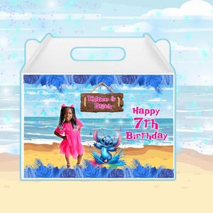 May include: A white party favor box with a beach-themed design. The box features a young girl in a pink dress, the character Stitch, and the text "Happy 7th Birthday." A wooden sign reads "Khloee & Stitch."