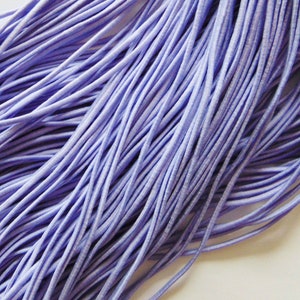 May include: A bundle of lavender elastic cord. The cord is soft and stretchy, ideal for crafting.