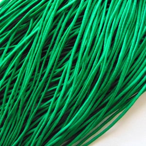 May include: A bundle of bright green elastic cord, perfect for crafting projects.