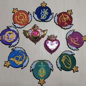 SAILOR scout SENSHI gevleugelde wereldbol opstrijkpatch