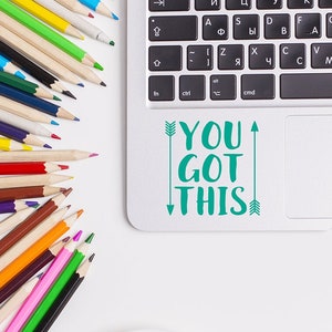 You got this vinyl laptop decal in teal