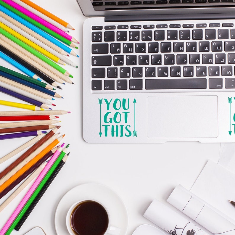 You got this vinyl laptop decal in teal