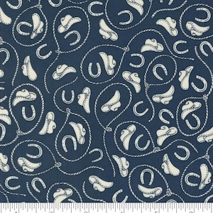 May include: A navy blue fabric with a white repeating pattern of cowboy hats, horseshoes, and lasso ropes. The fabric is a quilting cotton and is perfect for crafting projects.