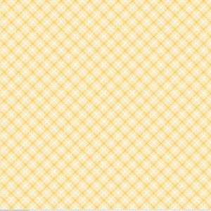 May include: A yellow and white plaid fabric with a repeating pattern of small squares. The fabric is a light yellow color with white lines creating a checkered pattern.