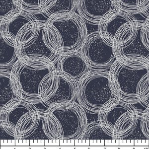 May include: A dark navy blue fabric featuring a repeating pattern of white, hand-drawn style overlapping circles with a speckled texture. A white ruler at the bottom shows measurements in inches, with text reading www.gardensongfabrics.com and 601-748-4870.