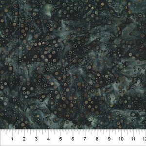 May include: A dark teal and black fabric featuring a mottled, marbled texture with scattered metallic bronze circular dots of varying sizes. A white ruler is visible at the bottom, showing measurements in inches from 1 to 12 inches.