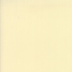 May include: A plain, off-white background.