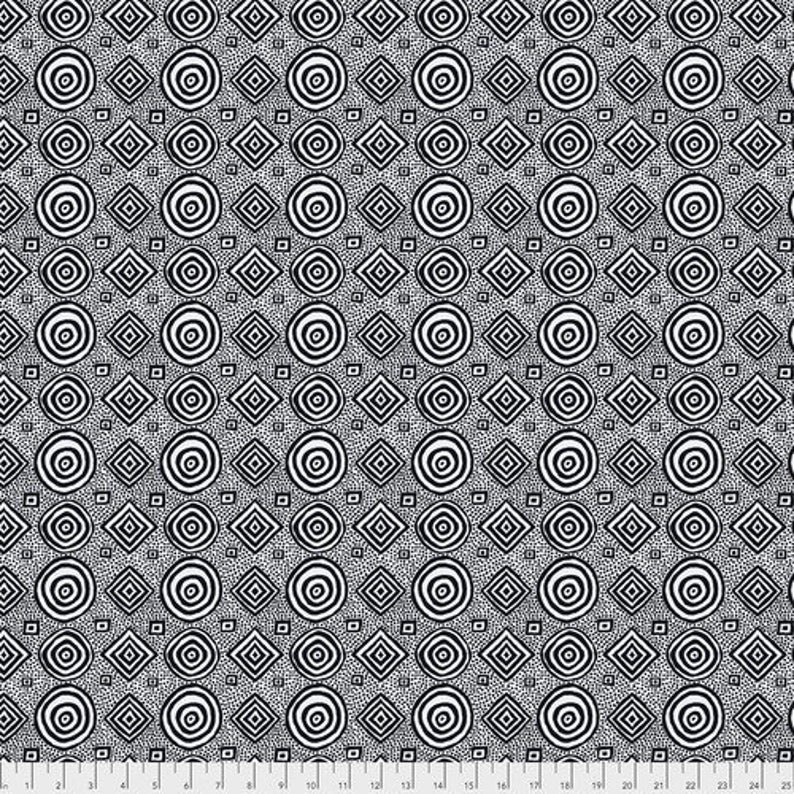 May include: Black and white patterned fabric featuring a repeating design of concentric circles, diamonds, and small dots. The design is evenly spaced across the fabric, creating a visually balanced and geometric pattern. The fabric is likely used for sewing or crafting projects.