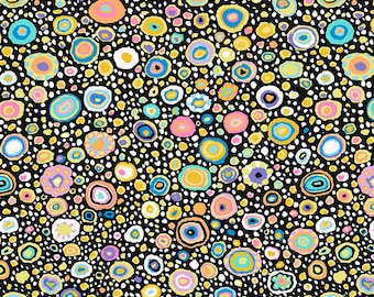 May include: Black fabric with a repeating pattern of colourful circles and dots. The circles are outlined in black and filled with various colours, including yellow, blue, pink, and green. The dots are white.