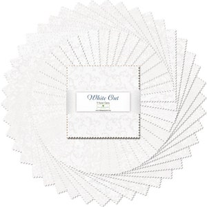 May include: A pack of 5-inch white fabric squares with a delicate floral pattern. The pack is called "White Out" and is by the brand Riley Blake Designs.