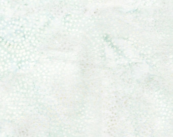 May include: A light mint green and white fabric featuring a subtle, mottled texture with a pattern of small, soft-focus white dots scattered across the surface, creating a delicate, airy appearance with a woven textile finish throughout.