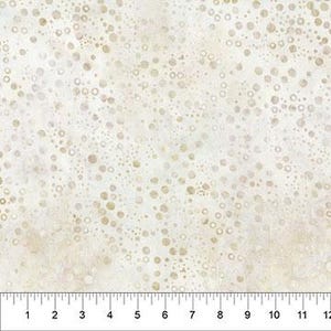 May include: Cream-colored fabric with a speckled pattern of varying-sized tan circles. A ruler is at the bottom, showing measurements in inches from 1 to 12.