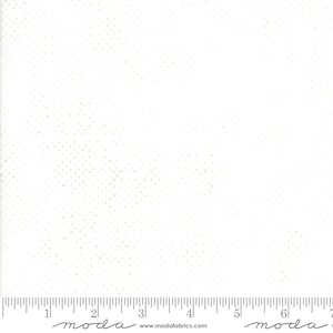 May include: White fabric with a subtle, light gray speckled pattern. The fabric is shown with a ruler measuring 7 inches.