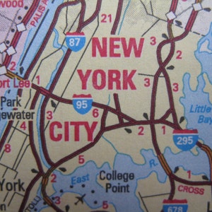 May include: A map of New York City with highways and roads marked. The map shows the city's major highways, including the 95, 87, and 295. The map also shows the names of some of the city's neighborhoods, including Fort Lee, Edgewater, Little Neck Bay, and College Point.