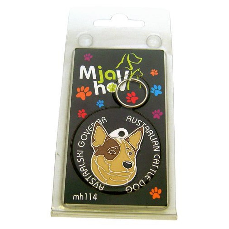 May include: A black dog tag with an Australian Cattle Dog illustration. The tag is circular with the words "AUSTRALIAN CATTLE DOG" around the dog's head. The tag is attached to a backing card with paw prints and the words "Mjay how".