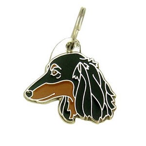 May include: A black and brown dachshund dog head charm for a pet ID tag. The charm is made of metal and has a shiny gold finish.
