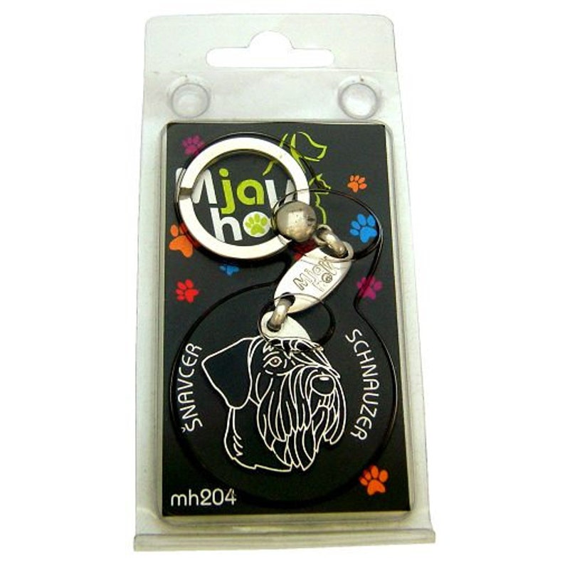 May include: Black and white silhouette of a Schnauzer dog on a black keychain with a silver key ring. The keychain has the text "Mjaw" and "Schnauzer" on it. The keychain is packaged in a clear plastic bag.