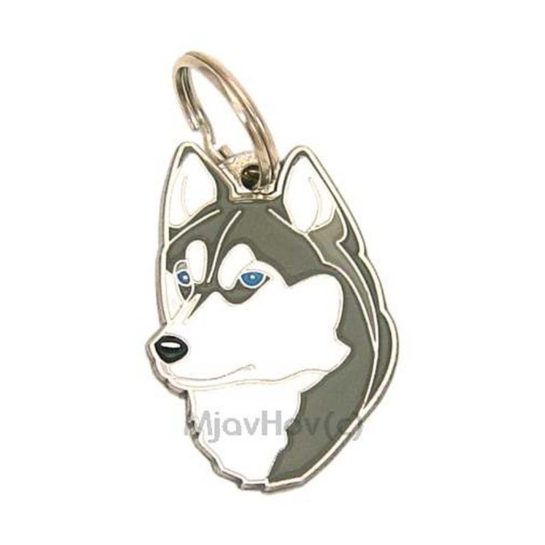 May include: A dog tag featuring a stylized illustration of a Husky's head. The tag has a silver-colored ring at the top. The Husky's fur is depicted in white, gray, and black, with blue eyes and a black nose. The tag is shaped like the dog's head.