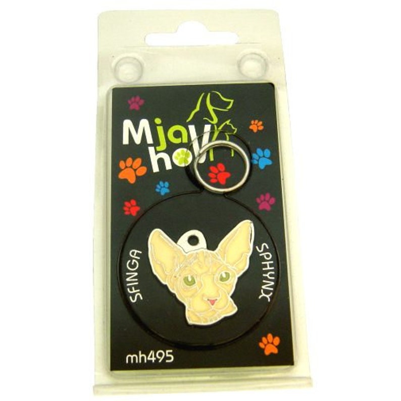 May include: A black and white round pet ID tag with a Sphynx cat image and the text "SFINGA SPHYNX" on the tag. The tag is on a black background with the text "Mjaw how mh495" on the bottom.