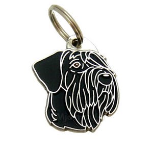 May include: Black and white dog breed keychain with a silver ring. The dog's head is facing the right side of the image. The keychain is made of metal.