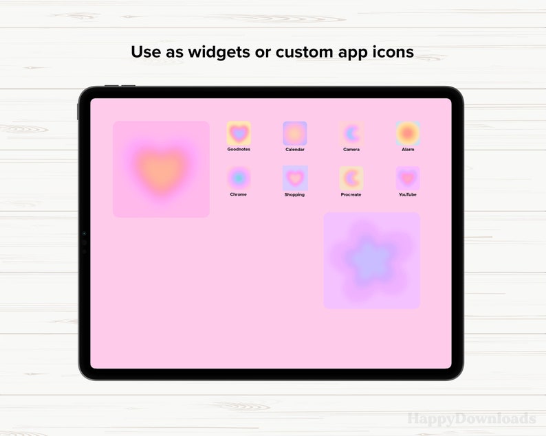 Op de afbeelding: Een tabletscherm met een roze achtergrond waarop kleurrijke gradi&euml;nticons te zien zijn voor apps zoals Goodnotes, Agenda, Camera, Alarm, Chrome, Winkelen, Procreate en YouTube. De tekst "Gebruik als widgets of aangepaste app-pictogrammen" staat bovenaan het scherm.