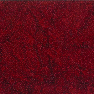 May include: Red fabric with a scattered pattern of small white dots.