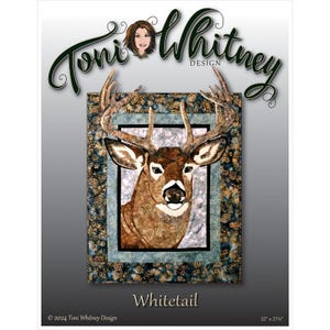 May include: A quilt pattern featuring a whitetail deer with a brown and tan patterned design. The deer is framed in a blue and gold patterned border. The quilt pattern is titled "Whitetail" and is 22" x 27".