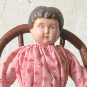Antique metal dolls top