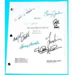 May include: A white paper with multiple signatures in black and blue ink. The title "WHAT ARE LITTLE GIRLS MADE OF" is visible, along with "STAR TREK" at the top. The document includes the text "REVISED FINAL DRAFT July 27, 1966".
