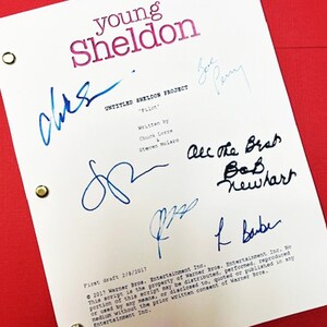 May include: A white script page for the TV show "Young Sheldon" with the title "Untitled Sheldon Project" and the episode title "Pilot". The page is signed by the show's creators Chuck Lorre and Steve Molaro, as well as actors Jim Parsons,  Bob Newhart, and  Zoe Perry.