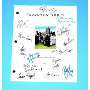 May include: A white script with the title "Downton Abbey" and signatures from the cast of the show. The signatures include Michelle Dockery, Hugh Bonneville, Elizabeth McGovern, Joanne Froggatt, Jim Carter, Brendan Coyle, Lesley Nicol, Phyllis Logan, and others. The script is from the pilot episode of the show.