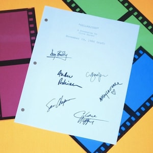 May include: A white page with the title "Hellraiser" and the text "A Screenplay by Clive Barker" and "November 19, 1986 Draft". The page is signed by six people, including Clive Barker.