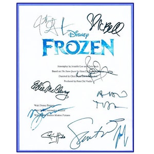 May include: A white sheet of paper with blue text that reads "Disney Frozen" and includes the names of the film's creators and producers. The paper is signed by several people, including Jennifer Lee, Chris Buck, Peter Del Vecho, and Eddie McClung.