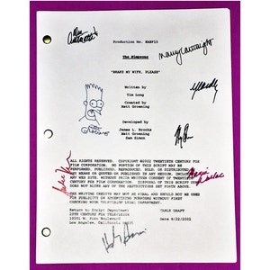 May include: A white script page with black text for the episode "Brake My Wife, Please" of The Simpsons. The script is dated 8/22/2002 and includes the names of the writers, creators, and developers. The page is signed by several people, including Matt Groening, who drew a cartoon of Bart Simpson in the top left corner.