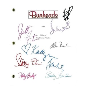 May include: A white sheet of paper with the title "Bunheads" written in red. The paper is signed by several people, including "Salty", "Alan", "Stacy", "Kathy", and "Barbie".
