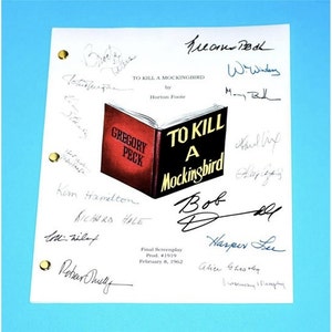 May include: A white script with the title "To Kill a Mockingbird" and a book cover illustration featuring Gregory Peck. The script is signed by the cast and crew, including Harper Lee, Gregory Peck, and Robert Duvall.