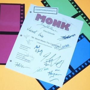 May include: A white sheet of paper with the title "MONK" and the words "Pilot Episode" and "Mr. Monk Meets The Candidates". The paper is signed by several people, including the actors and producers of the show.