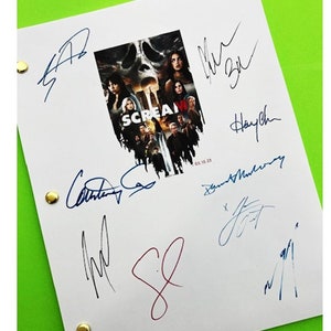 May include: A white paper with the movie poster for "Scream" and multiple signatures in blue and red ink. The poster features a skull and images of actors. The paper is held together with gold brads.