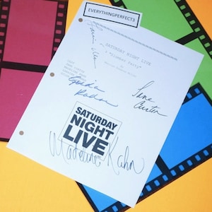 May include: A white sheet of paper with the text "SATURDAY NIGHT LIVE" in black and white. The paper is signed by Jane Curtin, Gilda Radner, and Madeline Kahn. The text "Slumber Party" is also visible on the paper.