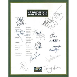 May include: A white sheet of paper with black text listing the credits for the movie Labyrinth. The paper is signed by several of the cast and crew members, including David Bowie, Jennifer Connelly, and Terry Jones.