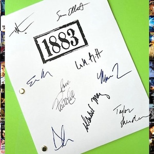 May include: A white script with the title "1883" in a black box and several signatures in black ink. The signatures include "Sam Elliott", "Tim McGraw", "Faith Hill", "LaM.  Hitt", "Taylor Sheridan", and "Isabel May".